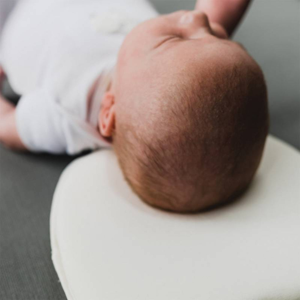 Almohada reposa cabeza ergonómico para bebés